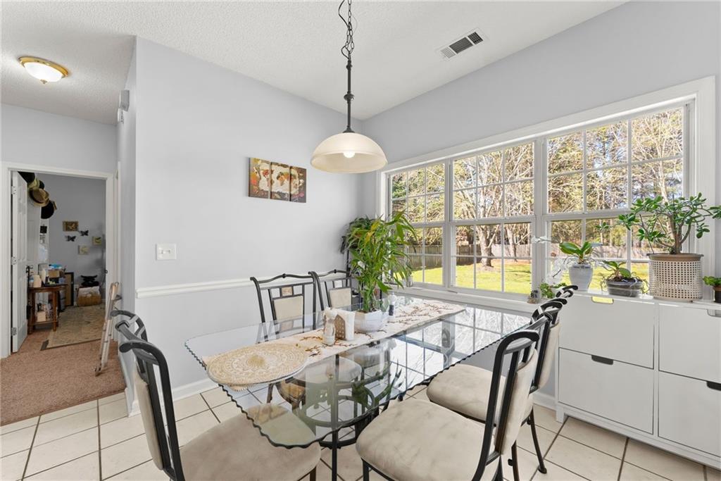 716 Michael Drive Winder, GA 30680 - Photo 11 of 46 a view of a dining room with furniture window and outside view