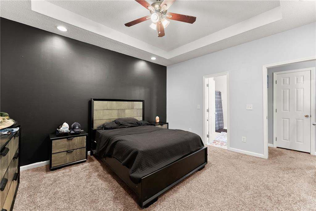 716 Michael Drive Winder, GA 30680 - Photo 19 of 46 a bedroom with a bed and window