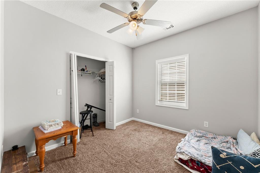 716 Michael Drive Winder, GA 30680 - Photo 24 of 46 a bedroom with bed and a window
