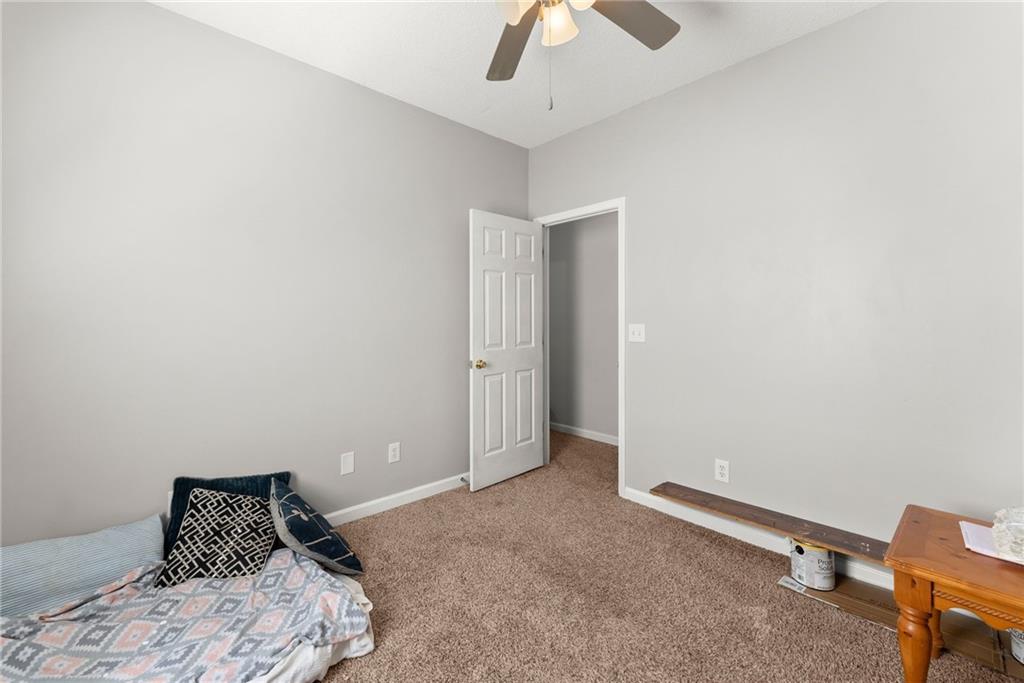 716 Michael Drive Winder, GA 30680 - Photo 25 of 46 a bedroom with a bed and a dresser
