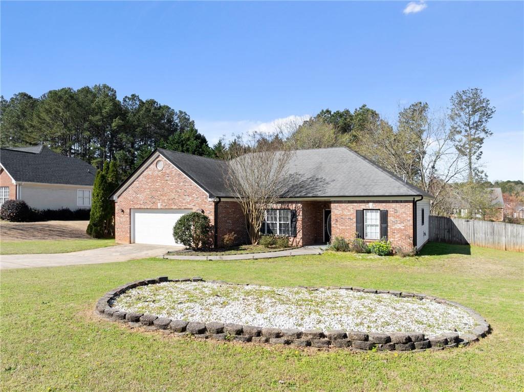 716 Michael Drive Winder, GA 30680 - Photo 3 of 46 a view of a house with yard and front view of a house