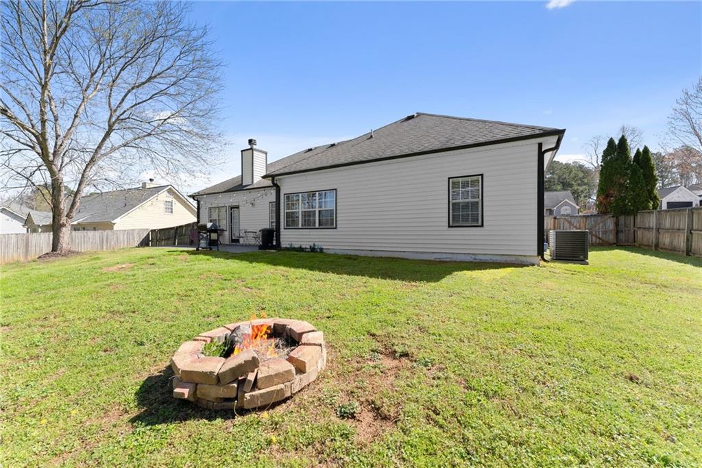 716 Michael Drive Winder, GA 30680 - Photo 34 of 46 a house view with a garden space