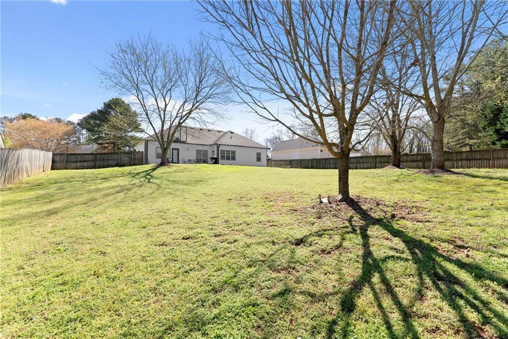 716 Michael Drive Winder, GA 30680 - Photo 37 of 46 a view of yard with tree