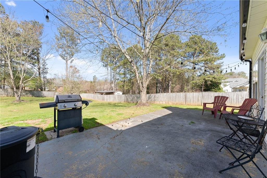 716 Michael Drive Winder, GA 30680 - Photo 38 of 46 a view of a swimming pool with a lounge chairs