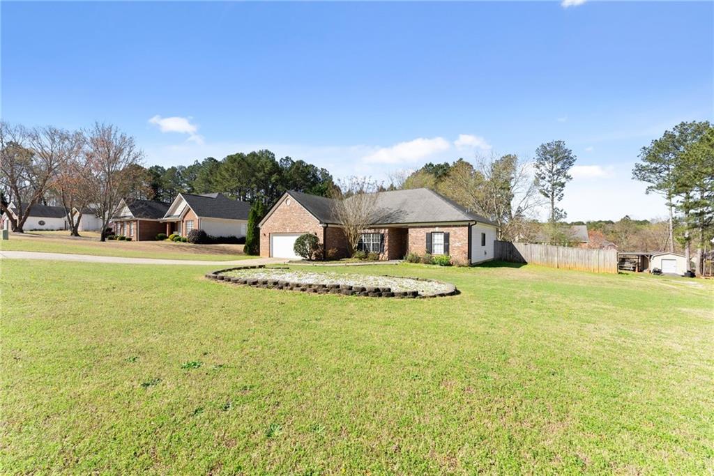 716 Michael Drive Winder, GA 30680 - Photo 6 of 46 a view of a house with a big yard