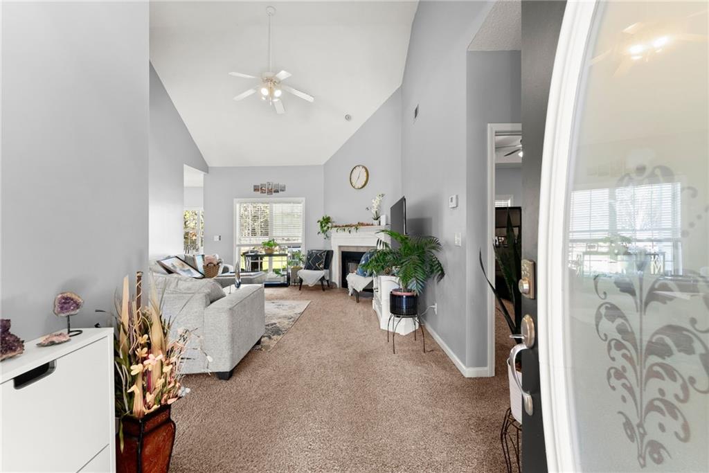 716 Michael Drive Winder, GA 30680 - Photo 7 of 46 a living room with furniture and a chandelier