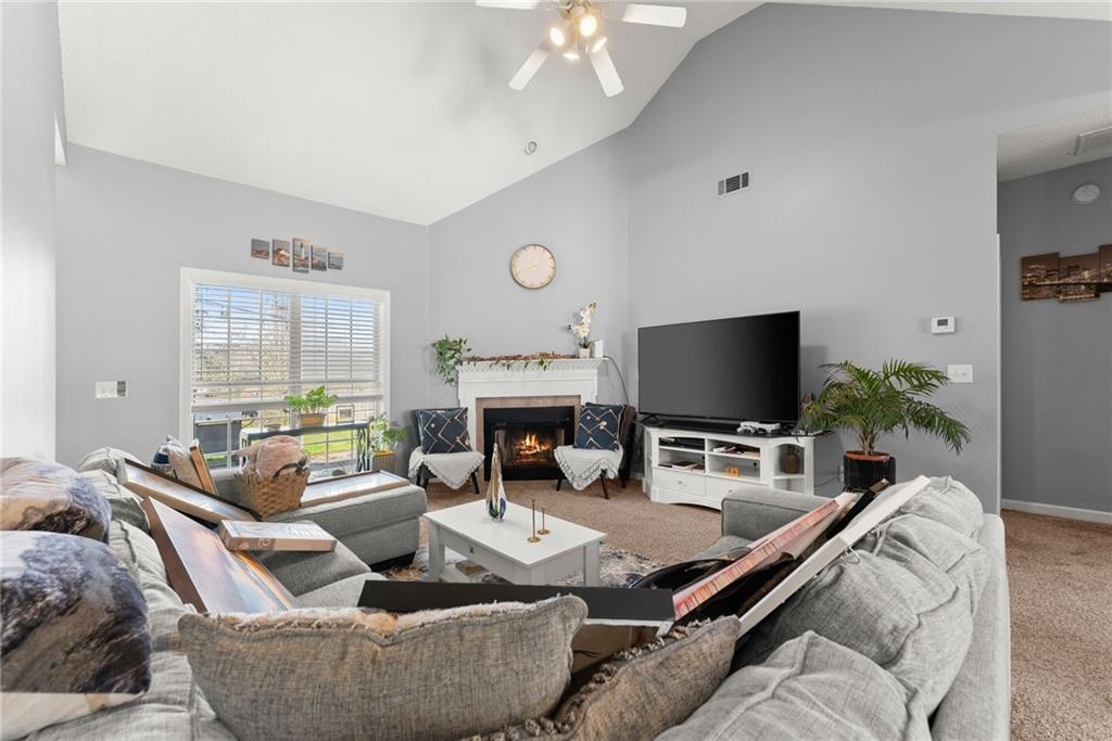 716 Michael Drive Winder, GA 30680 - Photo 9 of 46 a living room with furniture and a flat screen tv
