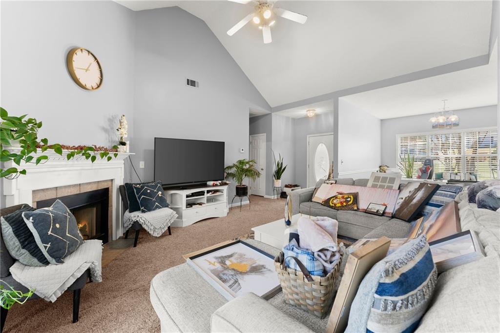 716 Michael Drive Winder, GA 30680 - Photo 10 of 46 a living room with furniture kitchen view and a large window