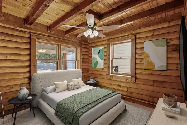 a bedroom with a bed a dresser next to a window