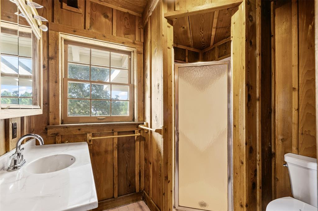 7329 Hickey Road Azle, TX 76020 - Photo 21 of 28 a bathroom with a sink and a large mirror