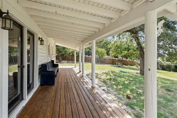 a view of balcony with wooden floor