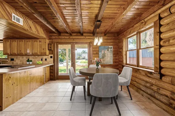 a open kitchen with dining table and chairs