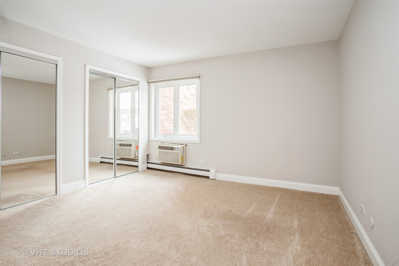 850 South Lorraine Road, Unit 1E Wheaton, IL 60189 - Photo 12 of 15 an empty room with windows