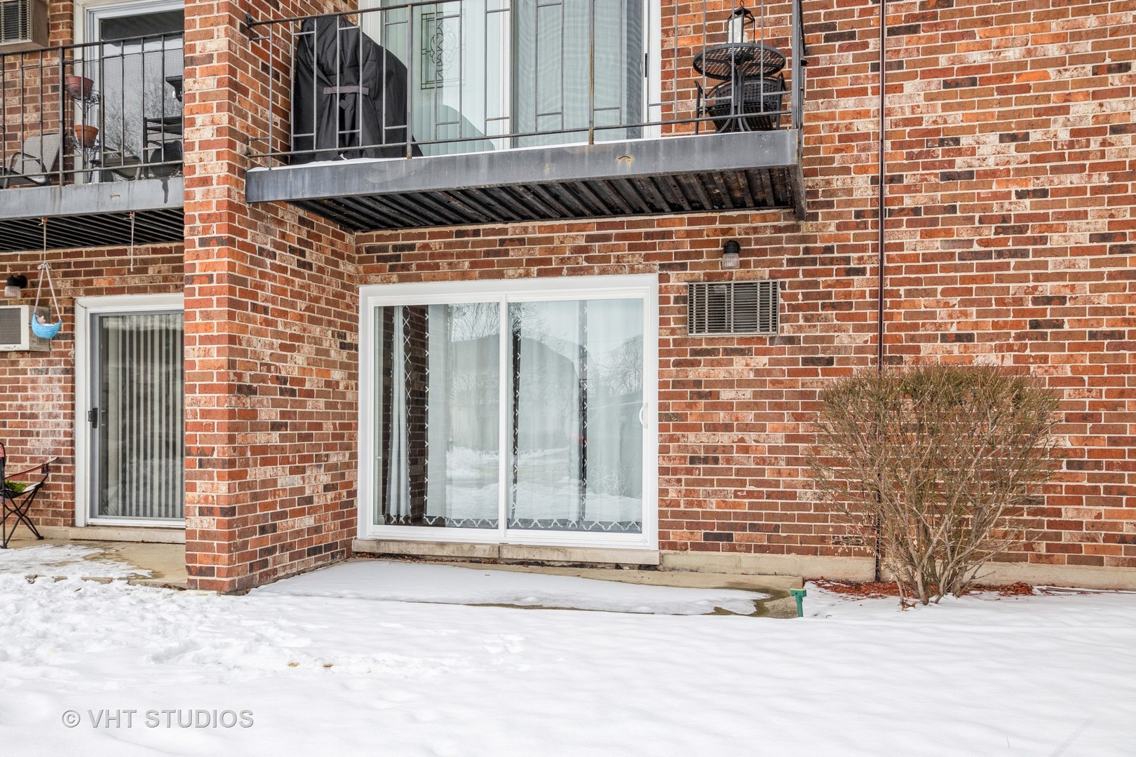 850 South Lorraine Road, Unit 1E Wheaton, IL 60189 - Photo 14 of 15 a front view of a building with a brick wall