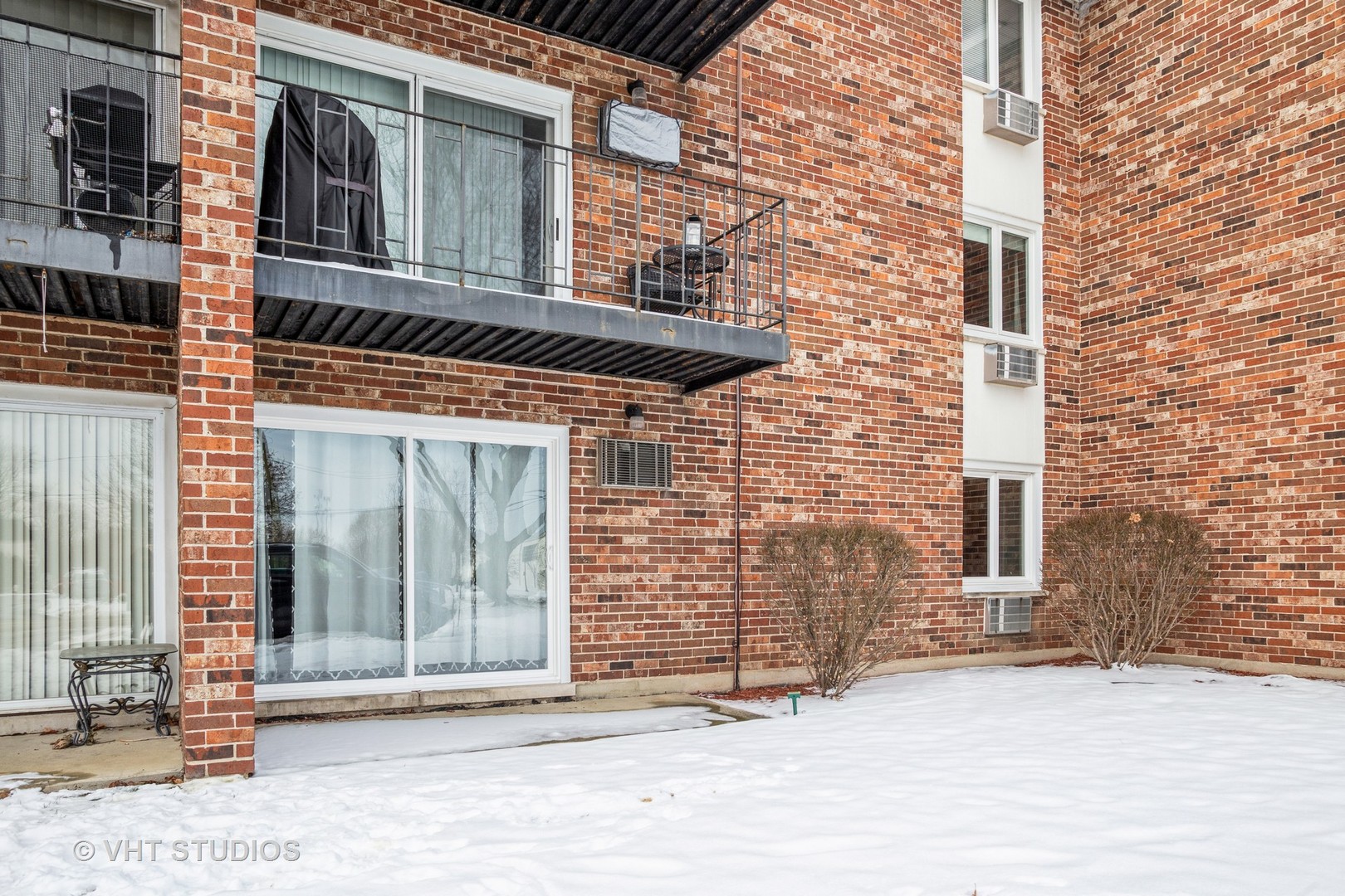 850 South Lorraine Road, Unit 1E Wheaton, IL 60189 - Photo 15 of 15 a view of a brick house with many windows
