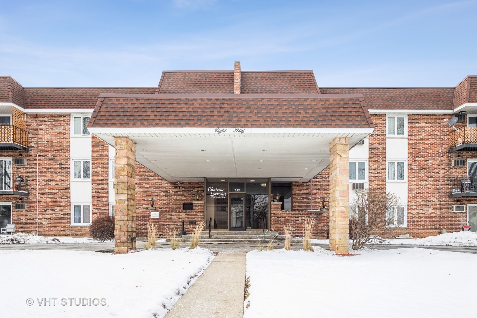 850 South Lorraine Road, Unit 1E Wheaton, IL 60189 - Photo 2 of 15 a view of a building with a street