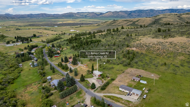 322 Bailey Creek Road Soda Springs, ID 83276 - Photo 32 of 32 Property featuring a main residence, multiple outbuildings, and expansive green spaces