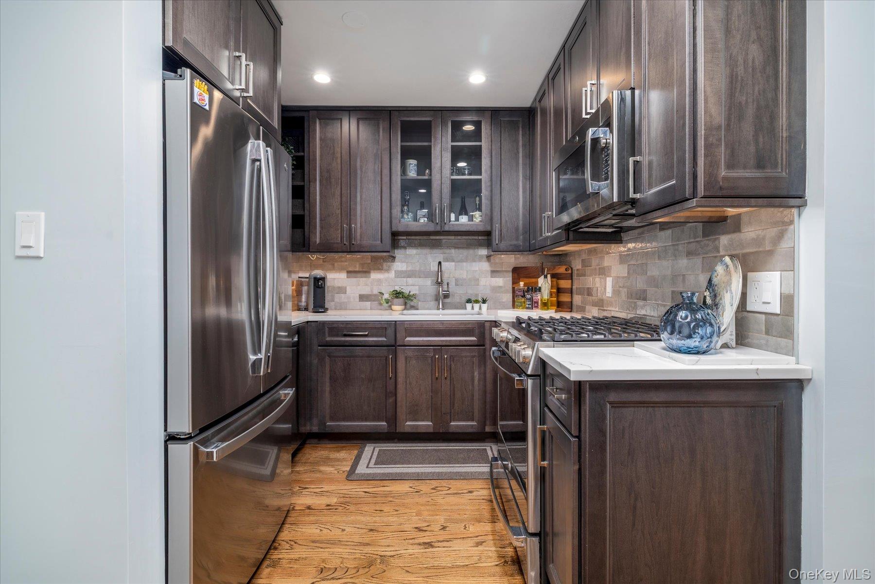 522 Shore Road, Unit 5T Long Beach, NY 11561 - Photo 4 of 22 Fully renovated kitchen with stainless steel appliances