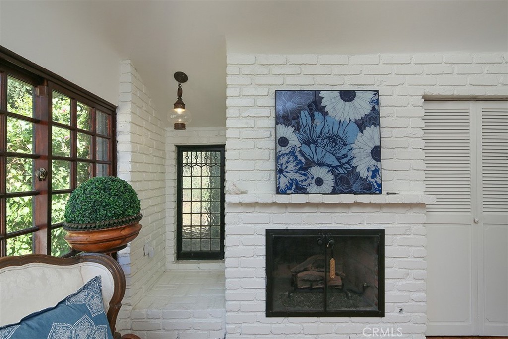 847 Victoria Drive Pasadena, CA 91104 - Photo 11 of 21 a living room with furniture and a fireplace
