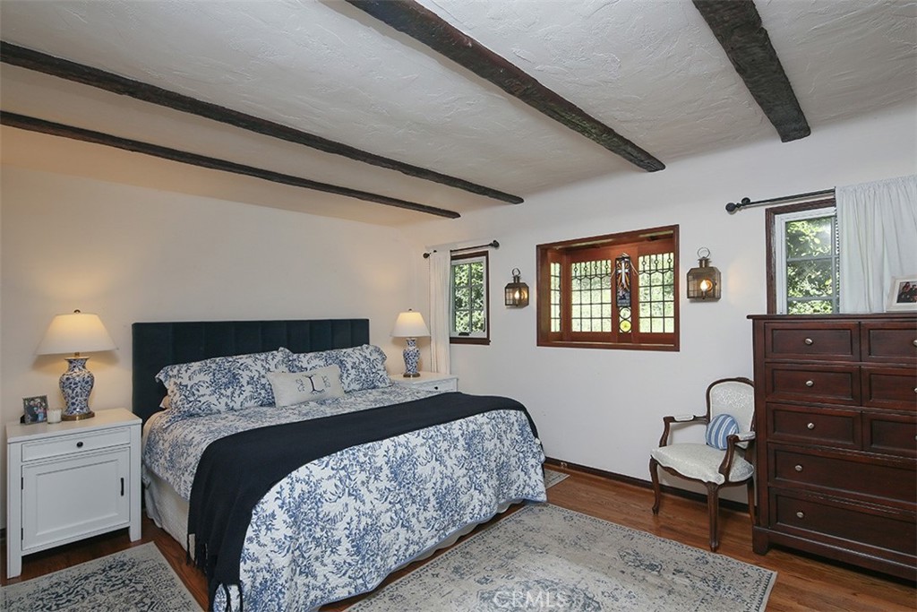 847 Victoria Drive Pasadena, CA 91104 - Photo 14 of 21 a bedroom with a bed and a dresser in it