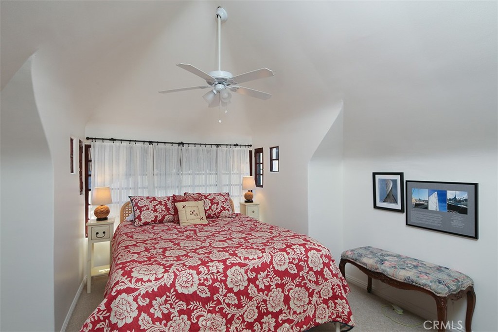 847 Victoria Drive Pasadena, CA 91104 - Photo 19 of 21 a bedroom with a bed and a chandelier