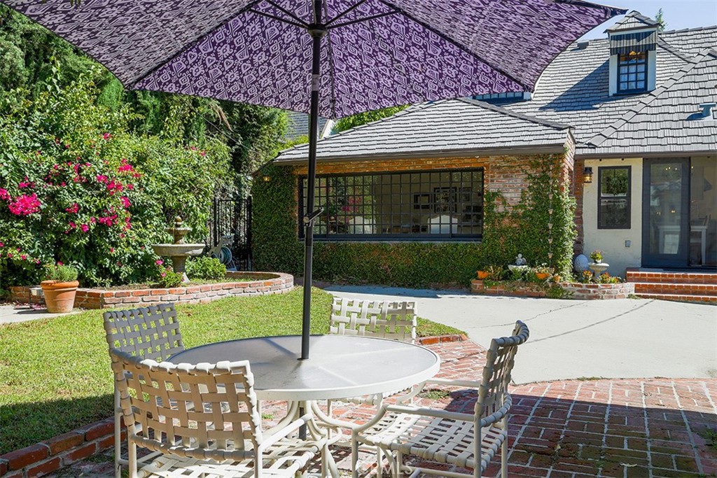 847 Victoria Drive Pasadena, CA 91104 - Photo 21 of 21 a view of a patio with table and chairs potted plants