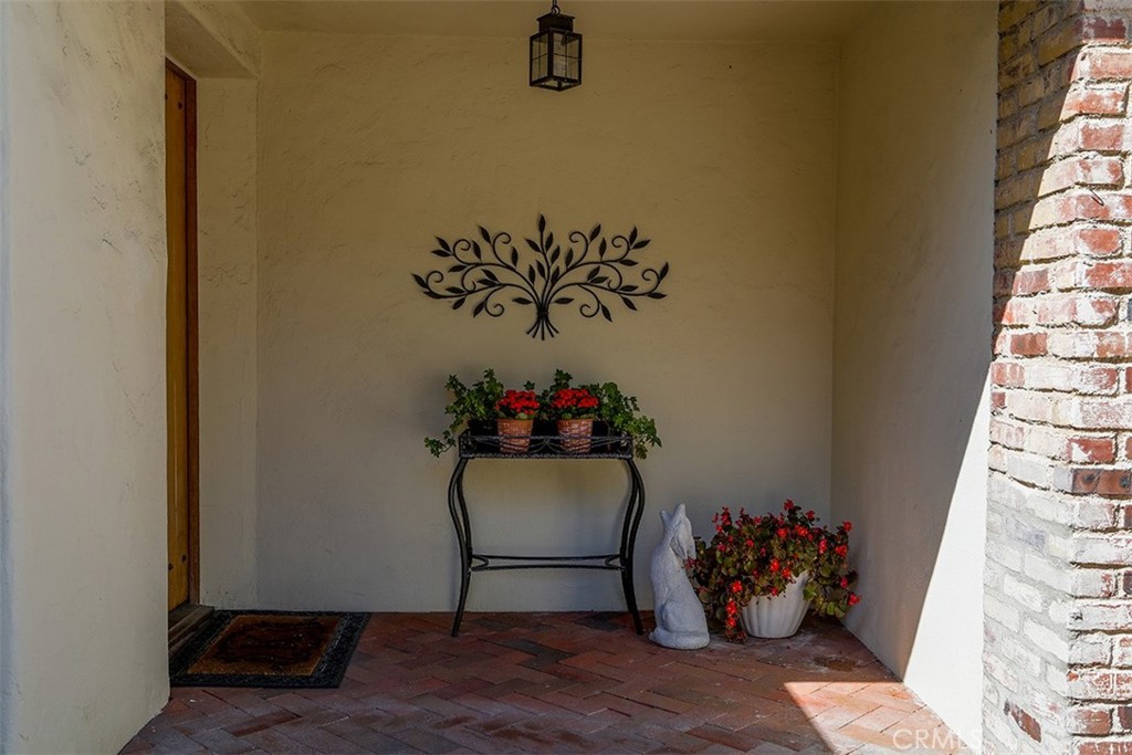 847 Victoria Drive Pasadena, CA 91104 - Photo 4 of 21 a room with a table and a potted plant