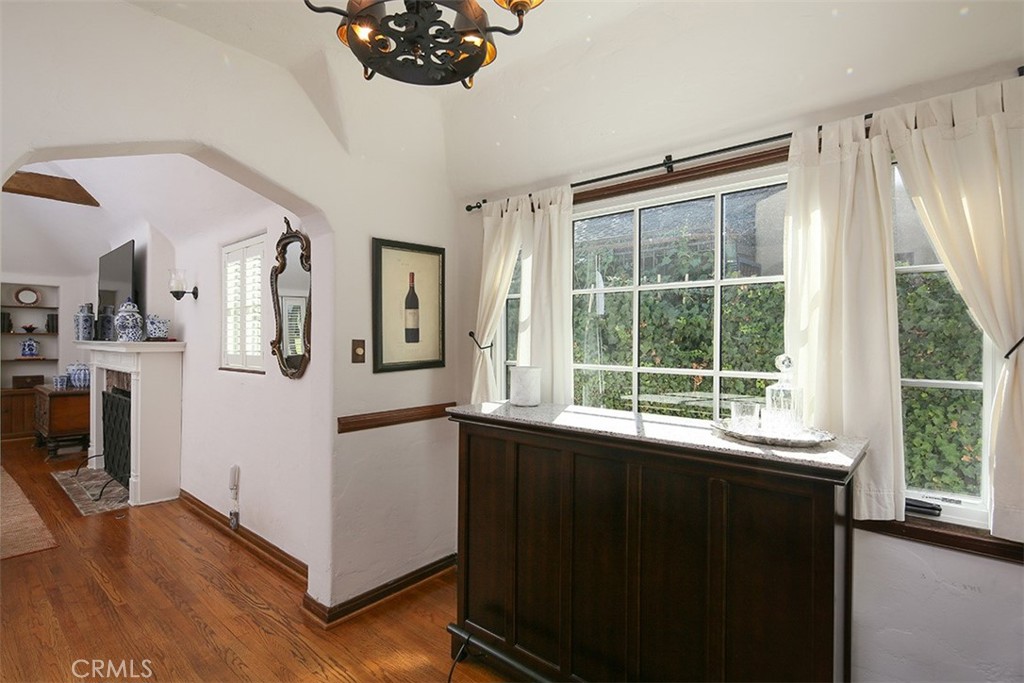 847 Victoria Drive Pasadena, CA 91104 - Photo 8 of 21 a view of a large window with wooden floor and a kitchen view