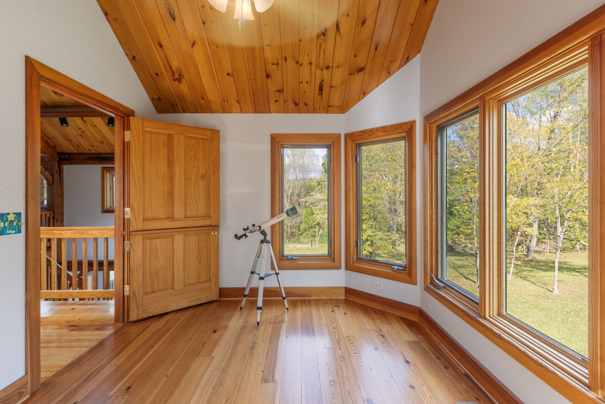 7725 Caney Fork Road Fairview, TN 37062 - Photo 26 of 58 a view of a room with wooden floor and stairs