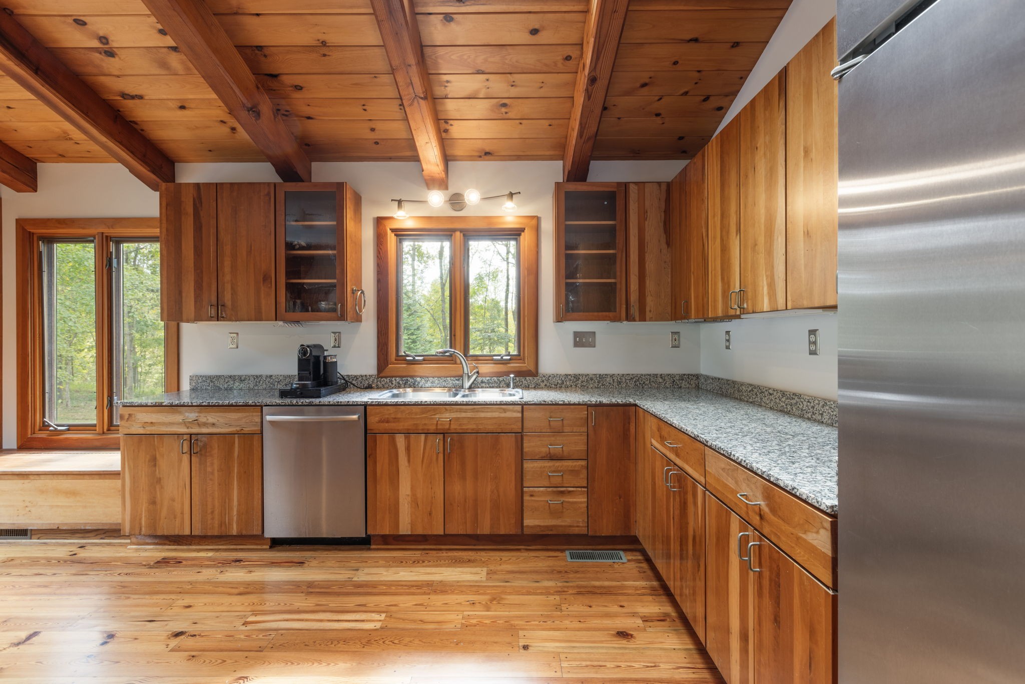 7725 Caney Fork Road Fairview, TN 37062 - Photo 10 of 58 a view of a kitchen with granite countertop a sink and a dishwasher