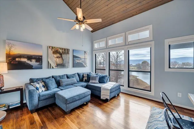 a bedroom with a bed and glass door
