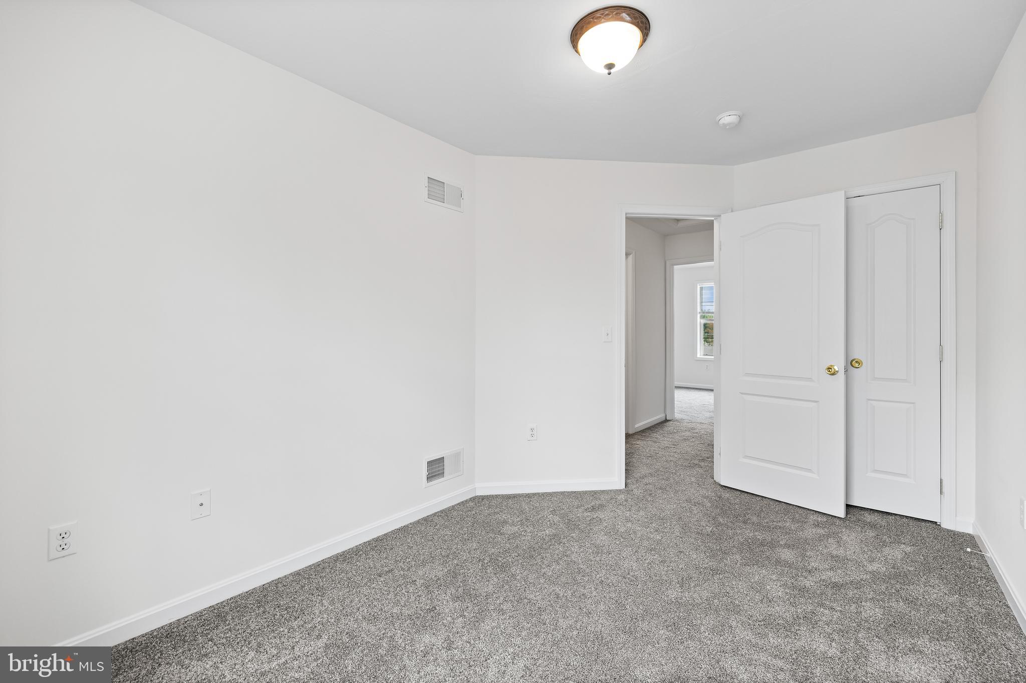 8 Shady Tree Court York, PA 17402 - Photo 21 of 23 an empty room with white walls and natural light