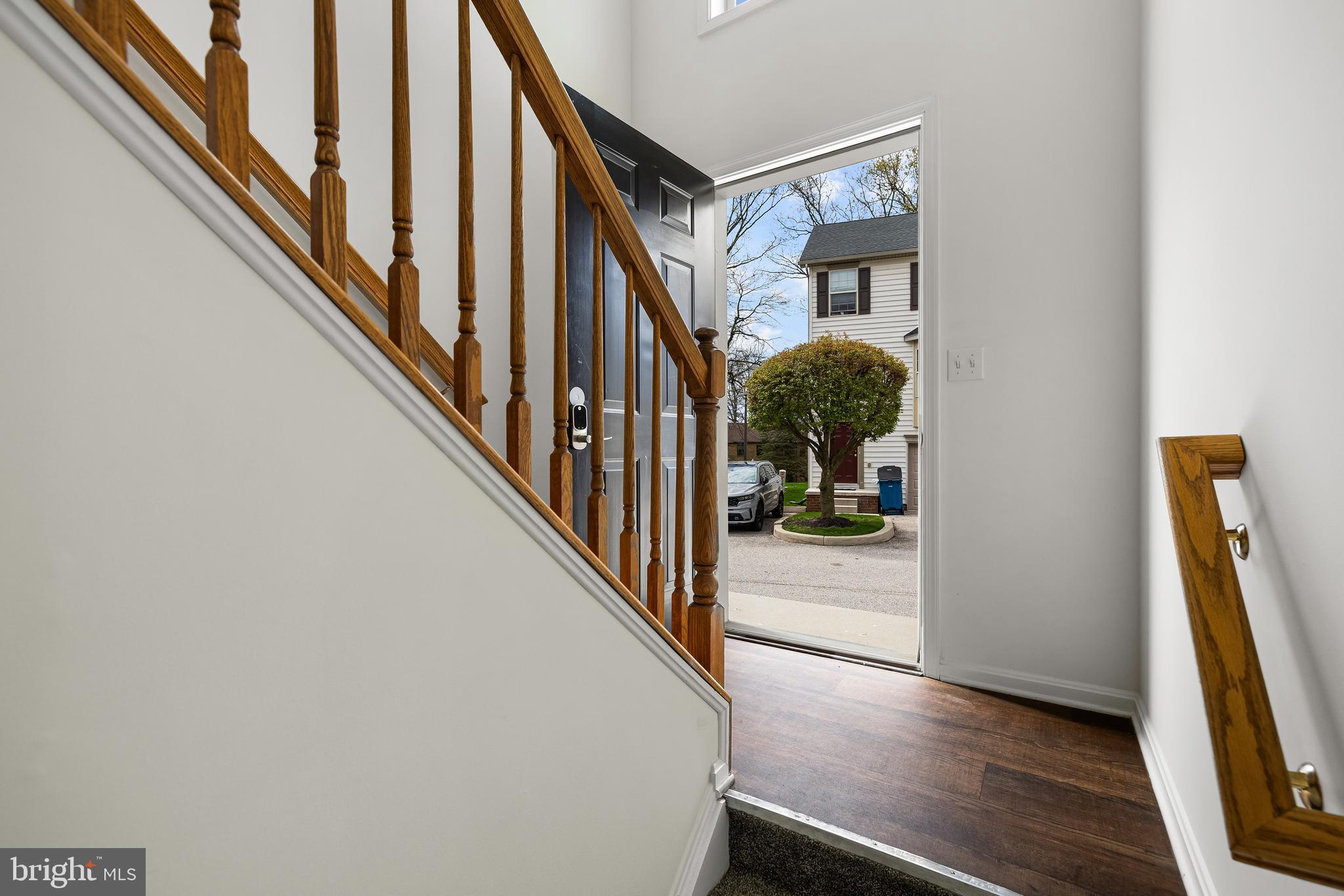 8 Shady Tree Court York, PA 17402 - Photo 3 of 23 a view of a hallway with wooden floor and stairs