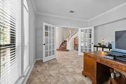 a view of kitchen with furniture and staircase