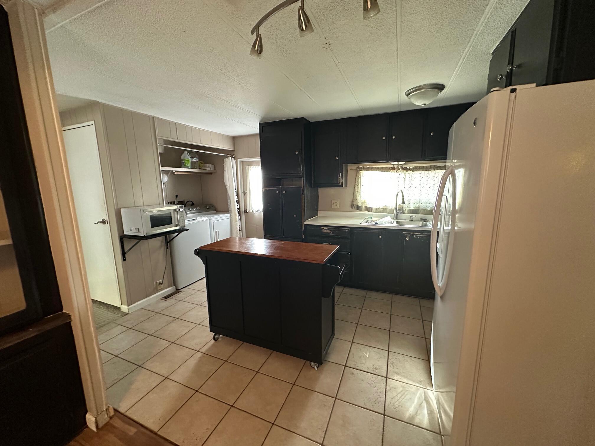 421 Stevens Road, Unit 52 Eagle Point, OR 97524 - Photo 8 of 18 a kitchen with stainless steel appliances a refrigerator and a stove