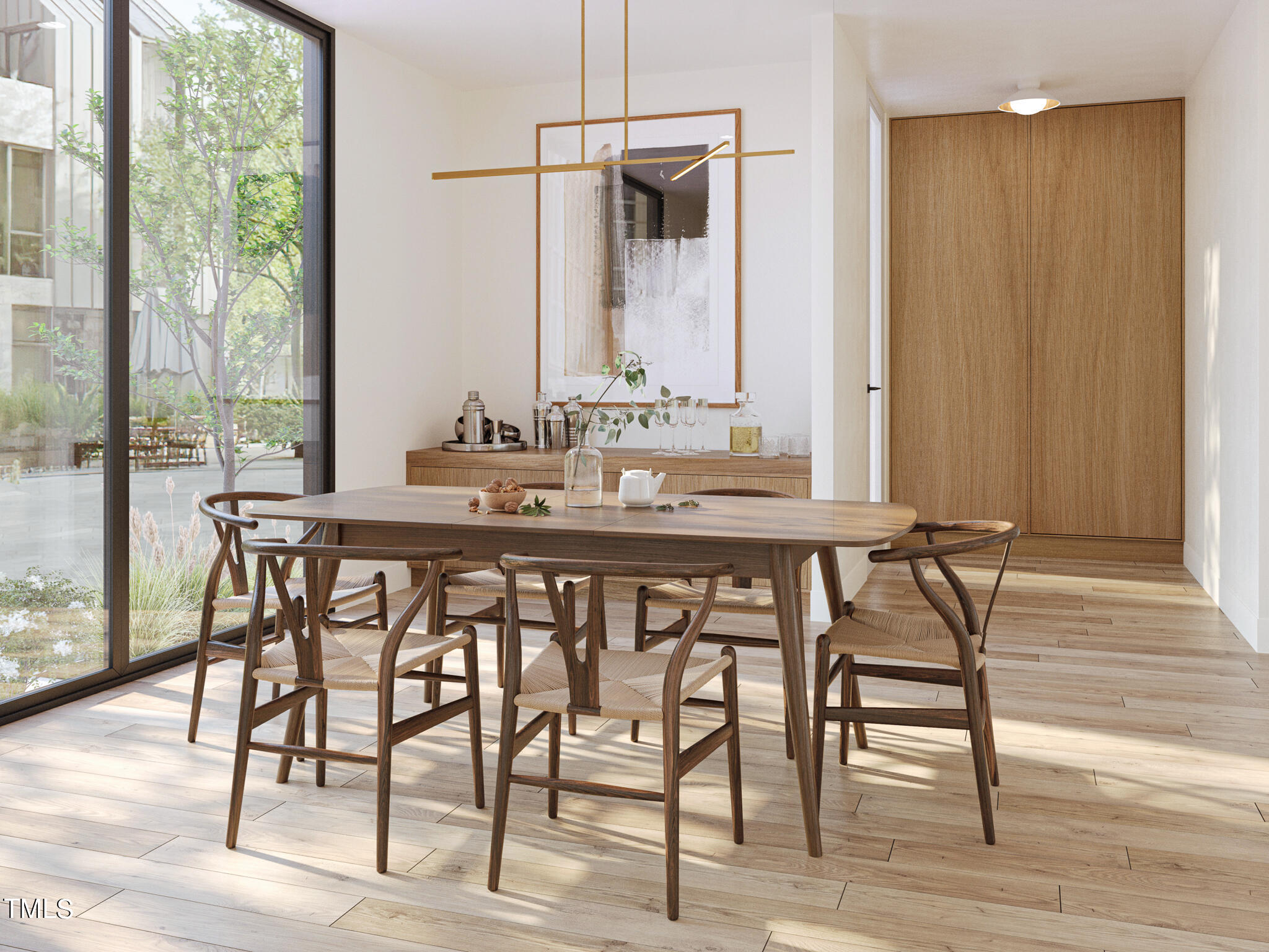 1310 Chamblee Hill Raleigh, NC 27608 - Photo 7 of 26 a view of a dining room and hall with wooden floor