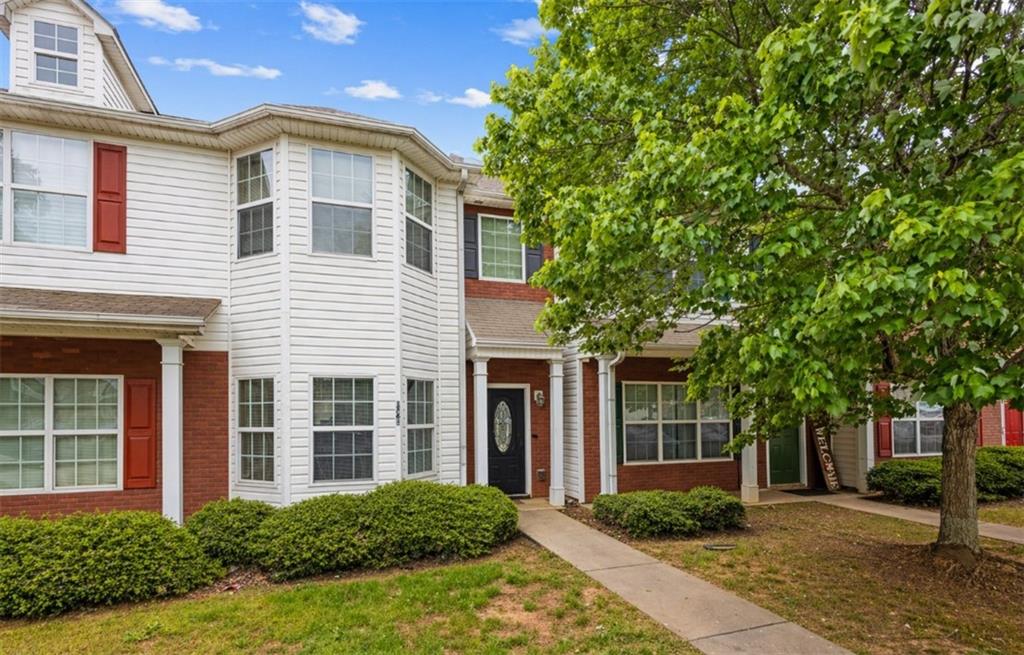 1761 Glen View Way Hampton, GA 30228 - Photo 1 of 1 a front view of a house with garden and trees