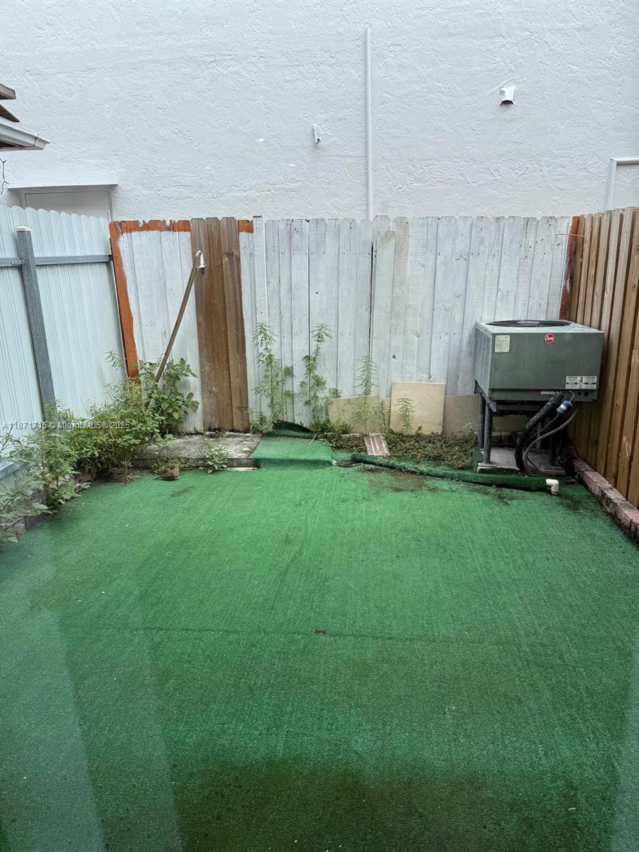 2377 West 66th Place, Unit 204 Hialeah, FL 33016 - Photo 12 of 17 a view of a backyard with a garden and entertaining space