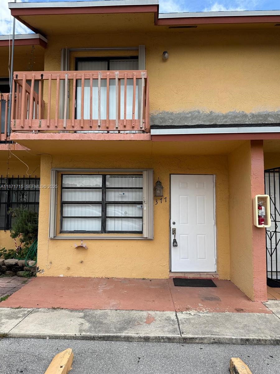2377 West 66th Place, Unit 204 Hialeah, FL 33016 - Photo 2 of 17 a front view of a house