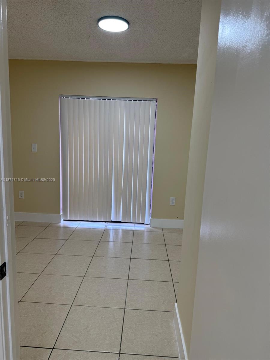 2377 West 66th Place, Unit 204 Hialeah, FL 33016 - Photo 5 of 17 an empty room with a bathroom