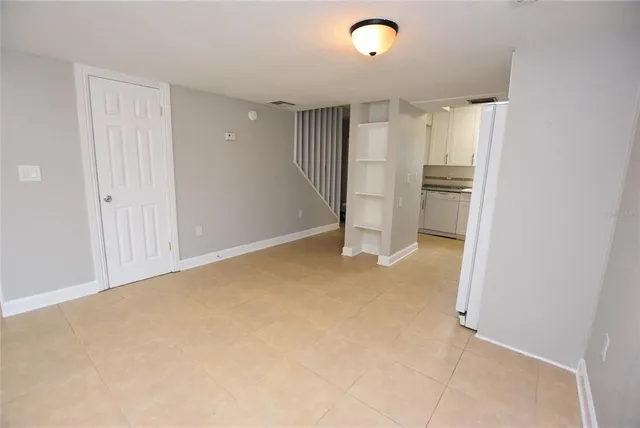 a view of an empty room with a window