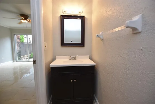 a bathroom with a sink and mirror
