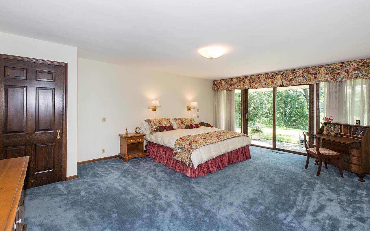 6825 Middle Road South Beloit, IL 61080 - Photo 12 of 23 a bedroom with a bed and a large window