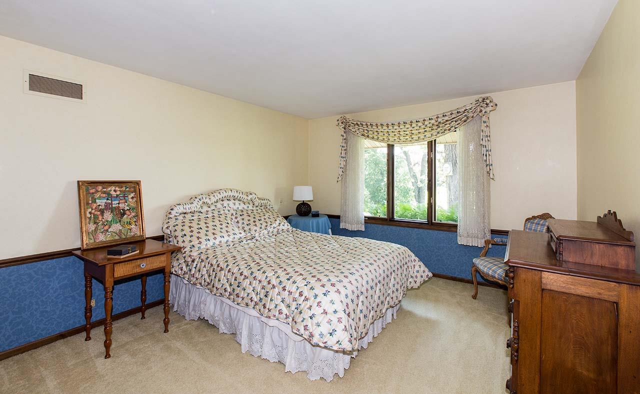 6825 Middle Road South Beloit, IL 61080 - Photo 15 of 23 a bedroom with a bed and a window