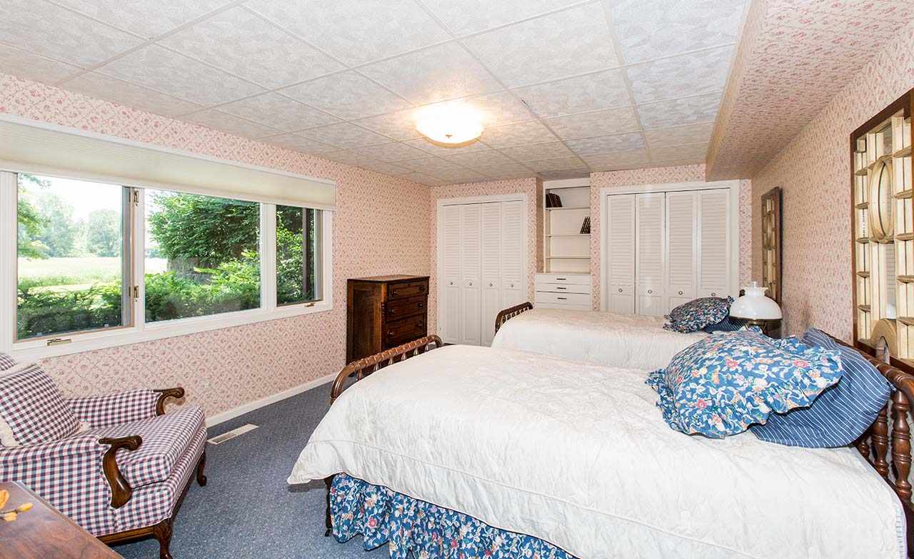 6825 Middle Road South Beloit, IL 61080 - Photo 16 of 23 a bedroom with a bed and a large window
