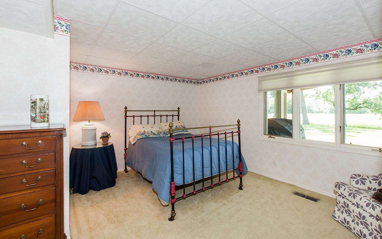 6825 Middle Road South Beloit, IL 61080 - Photo 17 of 23 a bedroom with a bed and window