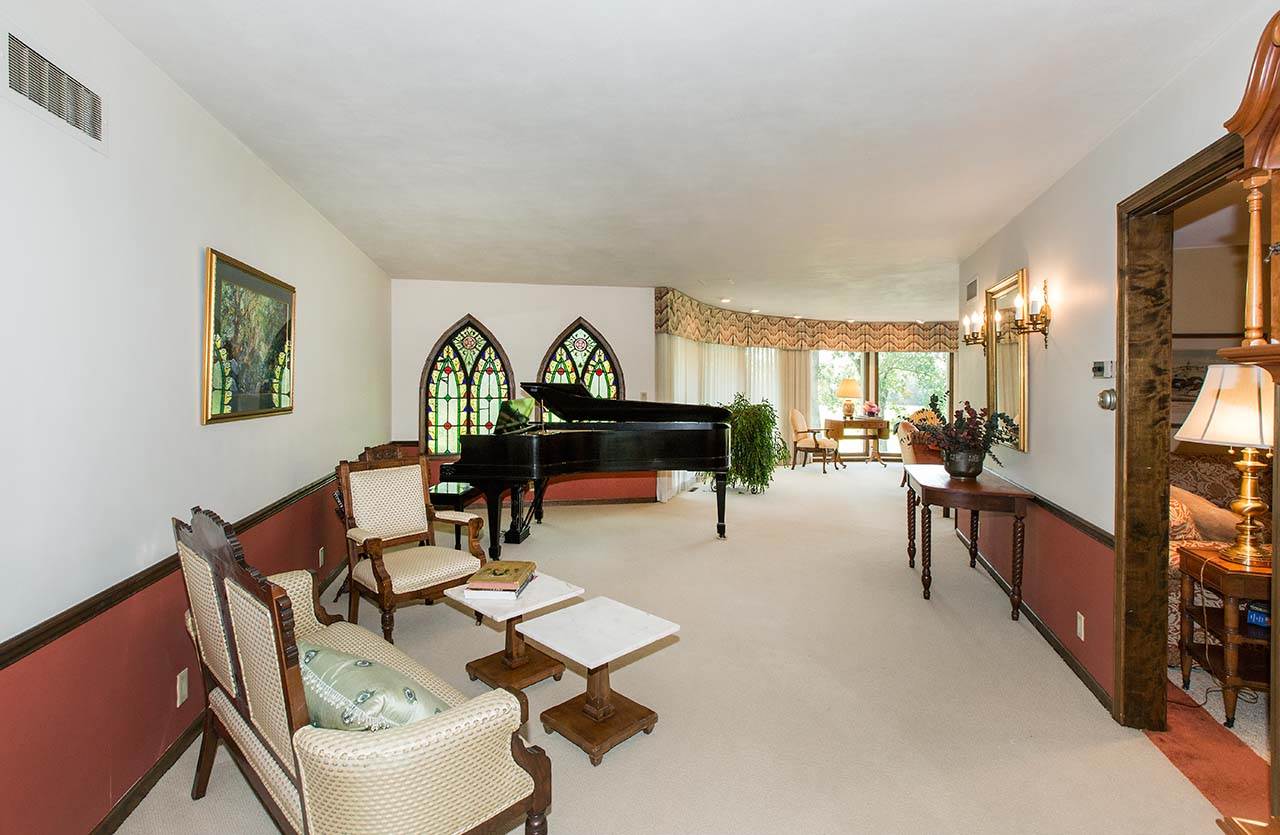6825 Middle Road South Beloit, IL 61080 - Photo 3 of 23 a living room with furniture a piano and a table