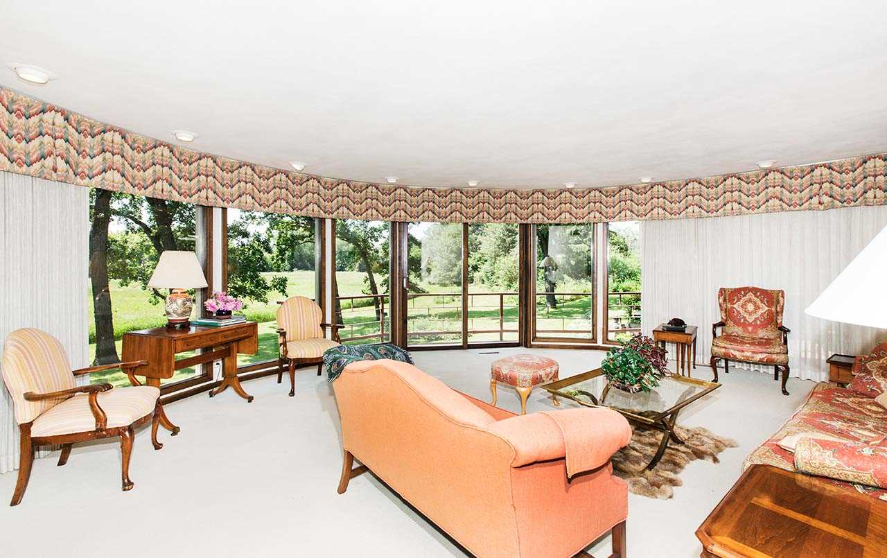 6825 Middle Road South Beloit, IL 61080 - Photo 4 of 23 a living room with furniture and a floor to ceiling window