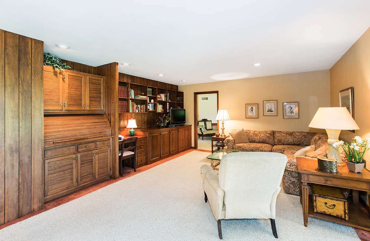 6825 Middle Road South Beloit, IL 61080 - Photo 6 of 23 a bed room with furniture and a flat screen tv
