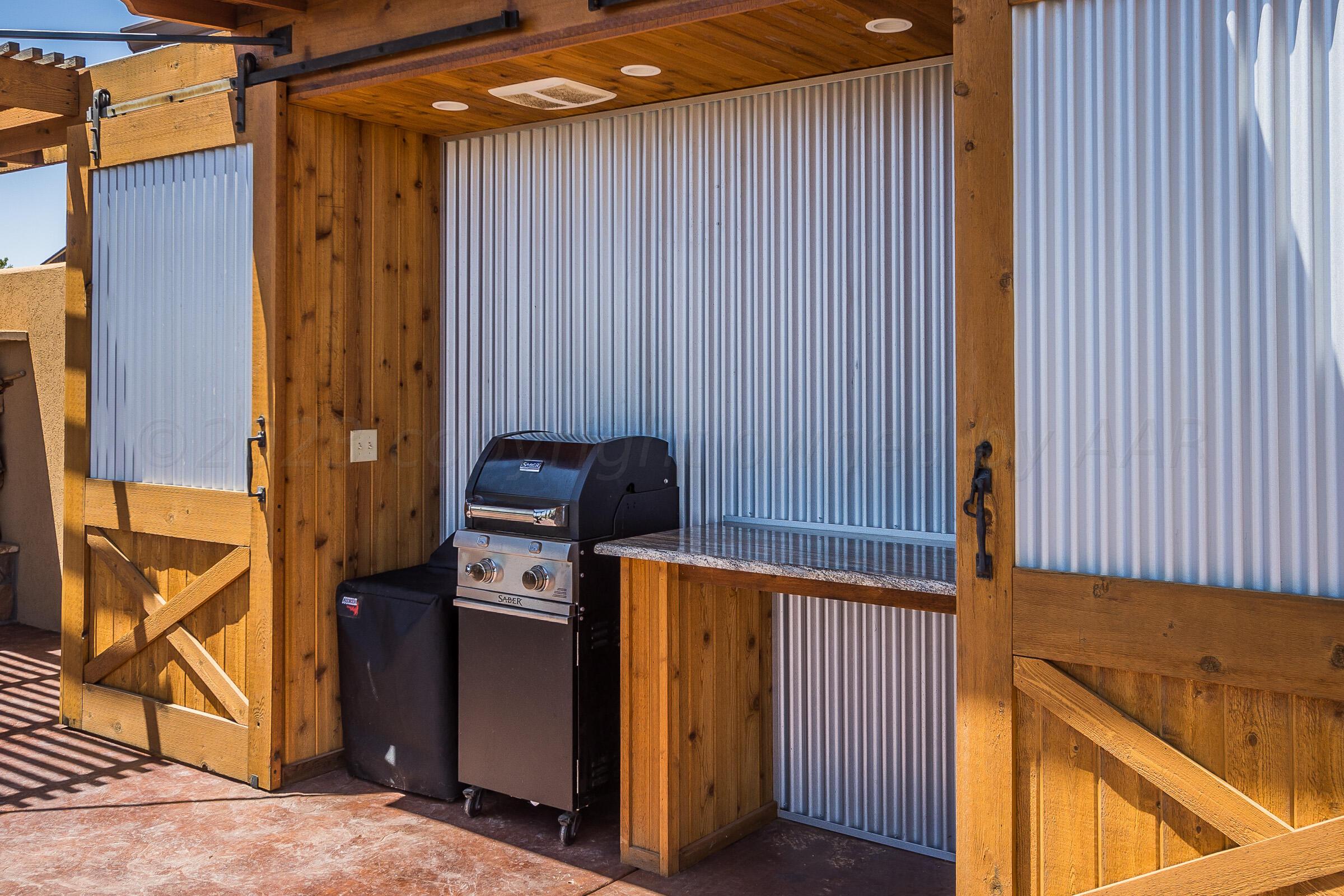7801 East Lake View Road Amarillo, TX 79118 - Photo 14 of 54 Grill Area with Barn Doors